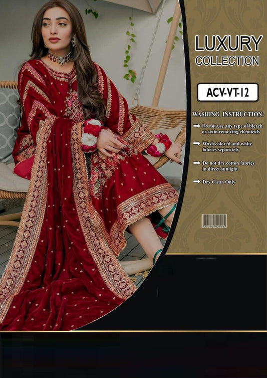 Woman in a red embroidered dress with a 'Luxury Collection' label on the right.