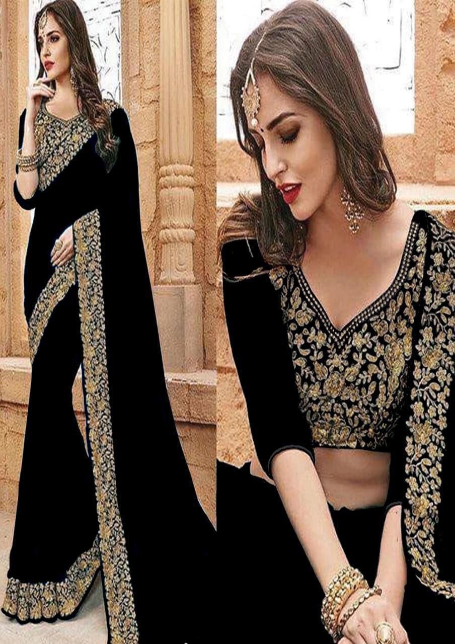 Black saree with gold embroidery worn by a model against an architectural background