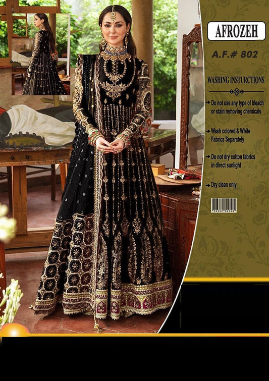 Woman in traditional black and gold embroidered outfit with 'Afrozeh' label on the right.