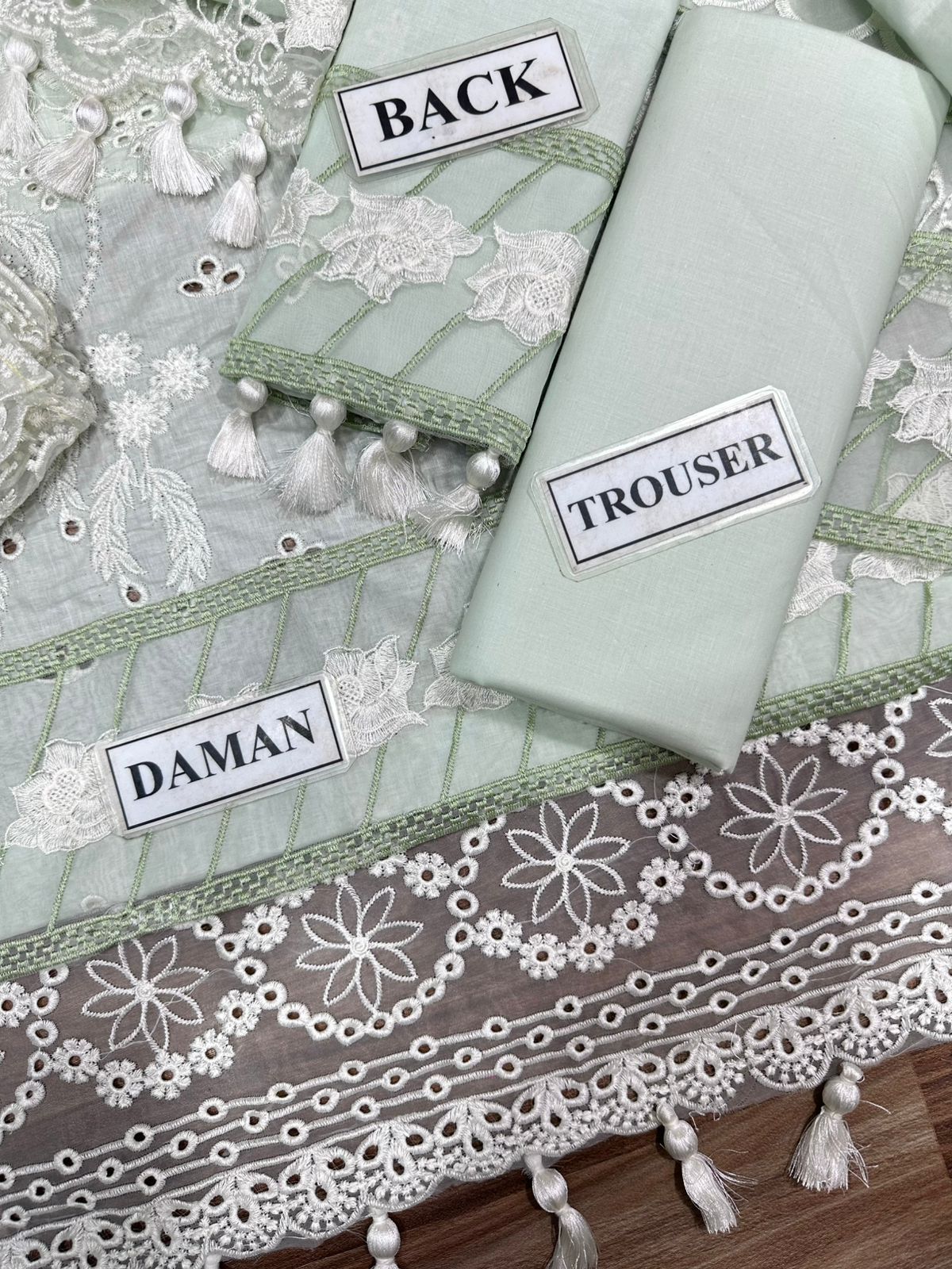 Light green fabric with lace details and labels indicating 'Daman', 'Back', and 'Trouser'.
