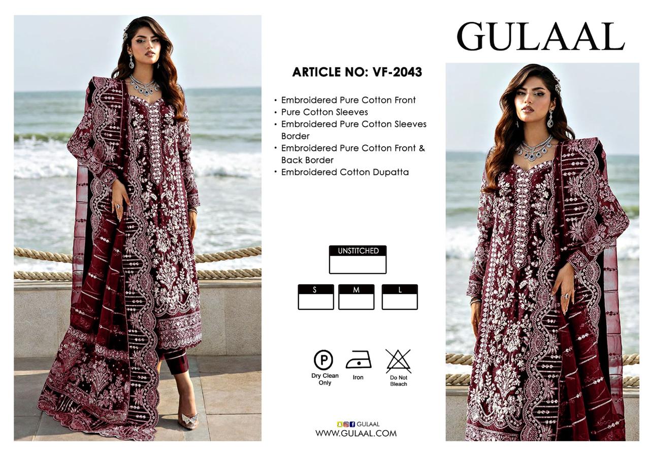 Gulaal Wedding Dress clothing advertisement with two models wearing embroidered outfits by the sea.