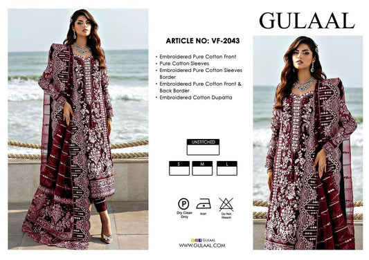 Gulaal Wedding Dress clothing advertisement with two models wearing embroidered outfits by the sea.