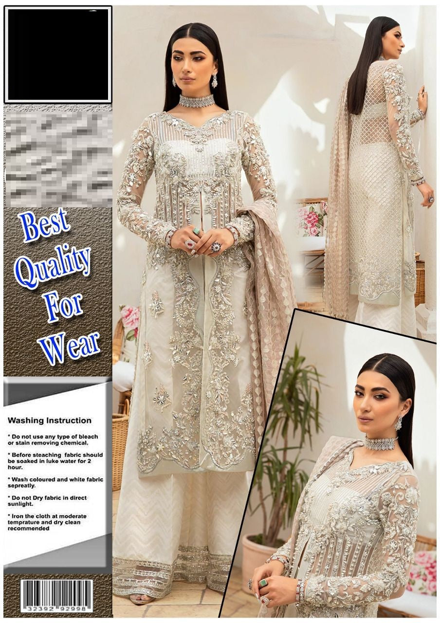 MAryam Hussain Roshni Woman wearing a white embroidered outfit with text about quality and washing instructions.
