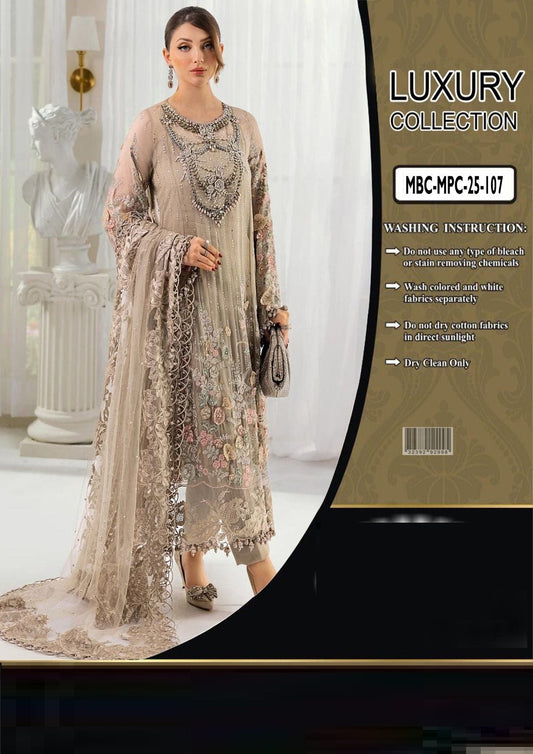 Maria b beige embroidered dress with a luxury collection packaging label.