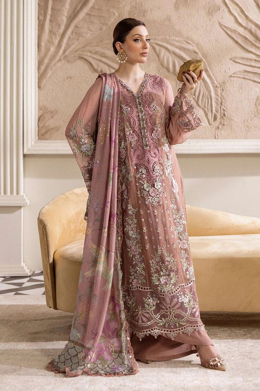 MAria b Most Demanding Design Tea pink Formal & Wedding Wear  embroidered traditional outfit standing in a decorated room.