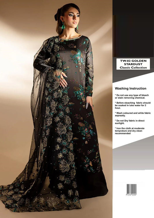 Nureh Golden Star Dust wearing a black embroidered saree with a beige background